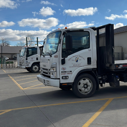 Box trucks with empty long beds.